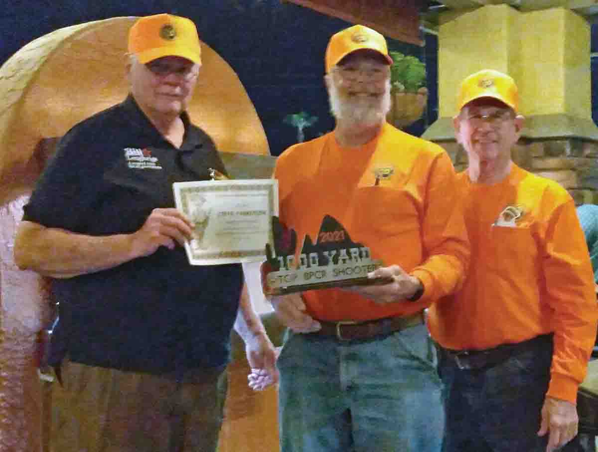 Steve Rhoades Memorial 1,000 Yard World Championship (left to right): AZWINS President Bill Loughrige, match winner Steve Farringer and his spotter Zack Taylor.